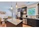 Modern kitchen featuring granite countertops, stainless steel appliances, and pendant lighting at 5036 Longview Walk, Decatur, GA 30035