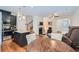 Bright living space showcasing hardwood floors, an open layout, and easy access to the kitchen at 5036 Longview Walk, Decatur, GA 30035