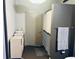 Bathroom featuring a shower, cabinet with drawers, and storage with baskets at 878 Peachtree Ne St # 608, Atlanta, GA 30309