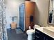 Well-lit bathroom with modern fixtures, a stylish vessel sink, a shower with a decorative curtain at 878 Peachtree Ne St # 608, Atlanta, GA 30309