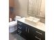 Bathroom featuring a modern vessel sink, wood cabinets, and a stylish mirror and fixtures at 878 Peachtree Ne St # 608, Atlanta, GA 30309