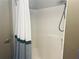 Bathroom featuring a modern shower stall with a black and white striped curtain and a handheld shower head at 878 Peachtree Ne St # 608, Atlanta, GA 30309