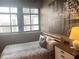 Bedroom featuring a large window, wood floors, stylish decor, and an adjacent closet at 878 Peachtree Ne St # 608, Atlanta, GA 30309