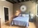 Cozy bedroom with a comfortable bed, wood floors, ambient lighting, and decorative wall art at 878 Peachtree Ne St # 608, Atlanta, GA 30309