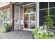 A modern building entrance framed by lush greenery, inviting residents and visitors with stylish curb appeal at 878 Peachtree Ne St # 608, Atlanta, GA 30309