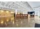 Open-concept common area featuring a large table with bar stools and a cozy lounge area, perfect for socializing at 878 Peachtree Ne St # 608, Atlanta, GA 30309