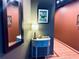 Inviting hallway featuring a decorative mirror, table lamp, and an art print enhancing the warm ambiance at 878 Peachtree Ne St # 608, Atlanta, GA 30309