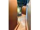 View of the well-lit hallway with attractive wood flooring, and earth tone walls leading to various rooms at 878 Peachtree Ne St # 608, Atlanta, GA 30309