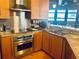 This kitchen features stainless appliances, a concrete countertop, and an eat-in breakfast bar at 878 Peachtree Ne St # 608, Atlanta, GA 30309
