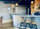 Well-lit kitchen with stainless breakfast bar, modern appliances, and stylish light fixtures at 878 Peachtree Ne St # 608, Atlanta, GA 30309
