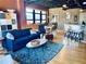 Stylish living room boasts an open floor plan, bar seating, and large windows for abundant natural light at 878 Peachtree Ne St # 608, Atlanta, GA 30309