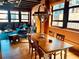 Bright living space featuring large windows, hardwood floors, modern furnishings, and a stylish dining area at 878 Peachtree Ne St # 608, Atlanta, GA 30309