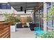 A modern outdoor patio featuring comfortable seating with plush cushions, decorative plants and a dining set at 878 Peachtree Ne St # 608, Atlanta, GA 30309
