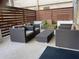 A modern outdoor patio provides comfortable seating with plush cushions around a coffee table and decorative plants at 878 Peachtree Ne St # 608, Atlanta, GA 30309