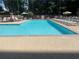 A large pool with lounge chairs and umbrellas provides a relaxing escape in a vibrant outdoor space at 878 Peachtree Ne St # 608, Atlanta, GA 30309