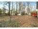 Large, wooded backyard with lawn shed and deck at 220 Mimosa Dr, Fayetteville, GA 30214