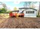 View of backyard featuring a deck, shed, and home at 220 Mimosa Dr, Fayetteville, GA 30214