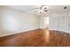 Bedroom with hardwood flooring, crown molding, closet and entry to an ensuite bathroom at 220 Mimosa Dr, Fayetteville, GA 30214