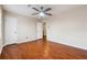 Spacious bedroom with wood floors, a ceiling fan, and neutral paint at 220 Mimosa Dr, Fayetteville, GA 30214