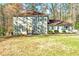 Charming two-story home with light-green siding, traditional windows, and a well-maintained front lawn at 220 Mimosa Dr, Fayetteville, GA 30214
