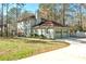 Charming home featuring an attached two-car garage, traditional shutters, and a neatly landscaped yard at 220 Mimosa Dr, Fayetteville, GA 30214