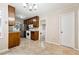 Traditional kitchen design with dark wood cabinetry, granite countertops, and modern stainless-steel appliances at 220 Mimosa Dr, Fayetteville, GA 30214
