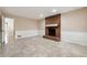 Open living room featuring a brick fireplace, tile flooring, and view to an open doorway at 220 Mimosa Dr, Fayetteville, GA 30214