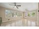 Bright sunroom features tiled floors, dual ceiling fans, and abundant natural light at 220 Mimosa Dr, Fayetteville, GA 30214