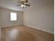Bedroom featuring ceiling fan, light fixture, neutral walls, and laminate flooring at 2398 Lawrenceville Hwy # K, Decatur, GA 30033