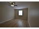 Bedroom featuring ceiling fan, light fixture, and window to let in natural light at 2398 Lawrenceville Hwy # K, Decatur, GA 30033