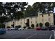 The exterior of this two-story tan condominium building has visitor parking at 2398 Lawrenceville Hwy # K, Decatur, GA 30033