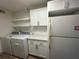 Convenient laundry room with washer, dryer, shelving, cabinets, and countertop space at 2398 Lawrenceville Hwy # K, Decatur, GA 30033