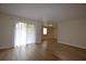 Spacious living room features hardwood floors and a sliding glass door leading to the outside at 2398 Lawrenceville Hwy # K, Decatur, GA 30033