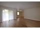 A spacious living room with hardwood floors and a sliding glass door at 2398 Lawrenceville Hwy # K, Decatur, GA 30033