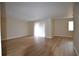 Living room featuring neutral walls, a sliding glass door, and laminate flooring at 2398 Lawrenceville Hwy # K, Decatur, GA 30033