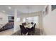 Bright dining room features a modern light fixture and a stylish black and white rug at 1006 Alcovy River Ct, Loganville, GA 30052