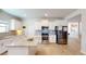 Well-lit kitchen with granite counters, stainless steel appliances, and white cabinetry at 1006 Alcovy River Ct, Loganville, GA 30052