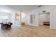 Living room and dining room with luxury vinyl plank flooring, modern lighting and neutral paint at 1006 Alcovy River Ct, Loganville, GA 30052