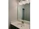Bathroom features a large mirror and bright vanity with unique lighting at 108 Fieldbrook Xing, Holly Springs, GA 30115