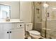 Modern bathroom featuring a glass-enclosed shower, white vanity, and stylish fixtures at 108 Fieldbrook Xing, Holly Springs, GA 30115