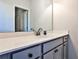 Bathroom features large mirror, white counter, and dark hardware at 108 Fieldbrook Xing, Holly Springs, GA 30115