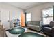 A Bedroom boasts a gray crib, rocking chair, and shelves filled with books and toys at 108 Fieldbrook Xing, Holly Springs, GA 30115