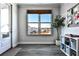 Welcoming entryway with a view of the neighborhood through a large window and a storage unit at 108 Fieldbrook Xing, Holly Springs, GA 30115