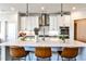 Modern kitchen with a white countertop island, stylish pendant lighting, and stainless steel appliances at 108 Fieldbrook Xing, Holly Springs, GA 30115