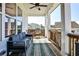 Relaxing outdoor patio with comfortable seating and a view of the surrounding neighborhood at 108 Fieldbrook Xing, Holly Springs, GA 30115