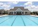 Large community pool featuring ample seating and a covered lounge area, perfect for relaxation at 108 Fieldbrook Xing, Holly Springs, GA 30115