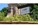 Edgewater community sign nestled among lush landscaping and stonework near the community entrance at 108 Fieldbrook Xing, Holly Springs, GA 30115