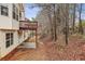 Exterior home view featuring a backyard with deck, and natural tree views at 1559 Hillary Cove Ct, Lawrenceville, GA 30043