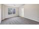 Bedroom featuring neutral paint and carpet, a large window, and an ensuite bath at 1559 Hillary Cove Ct, Lawrenceville, GA 30043