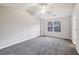 Spacious bedroom with a ceiling fan, vaulted ceilings and natural light at 1559 Hillary Cove Ct, Lawrenceville, GA 30043